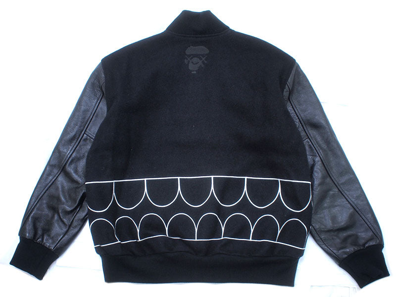 A BATHING APE×KAWS 'Chompers Varsity Jacket' Stadium Jacket Teeth Pattern Varsity Jacket Black KAWS BAPE A BATHING APE