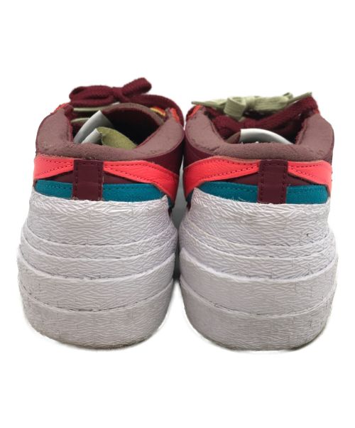 SACAI x KAWS" TEAM RED