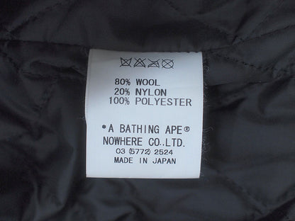 A BATHING APE×KAWS 'Chompers Varsity Jacket' Stadium Jacket Teeth Pattern Varsity Jacket Black KAWS BAPE A BATHING APE